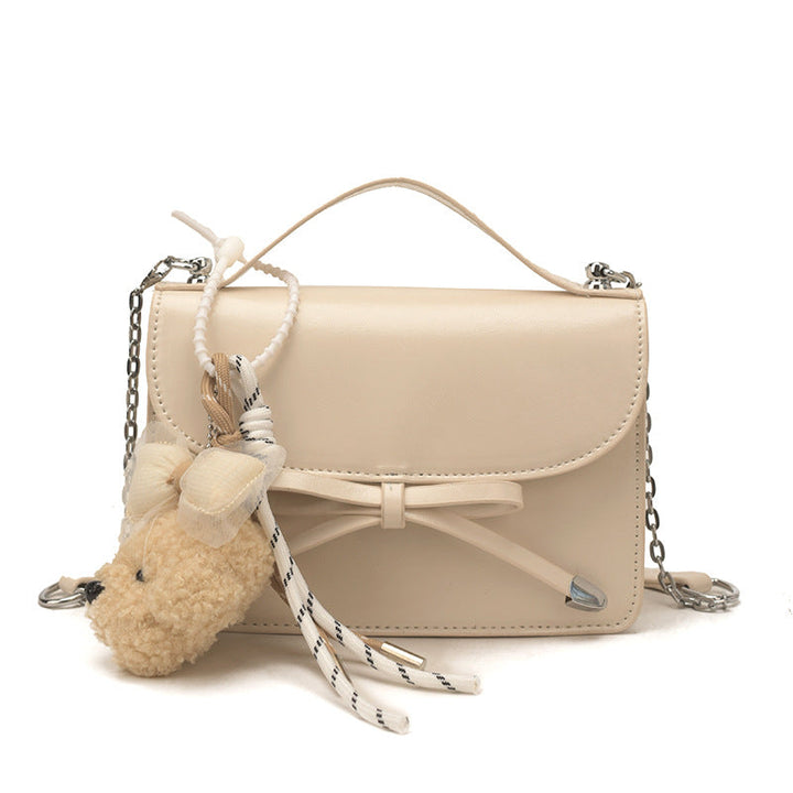 Women elegant mini handbag with cute pendant