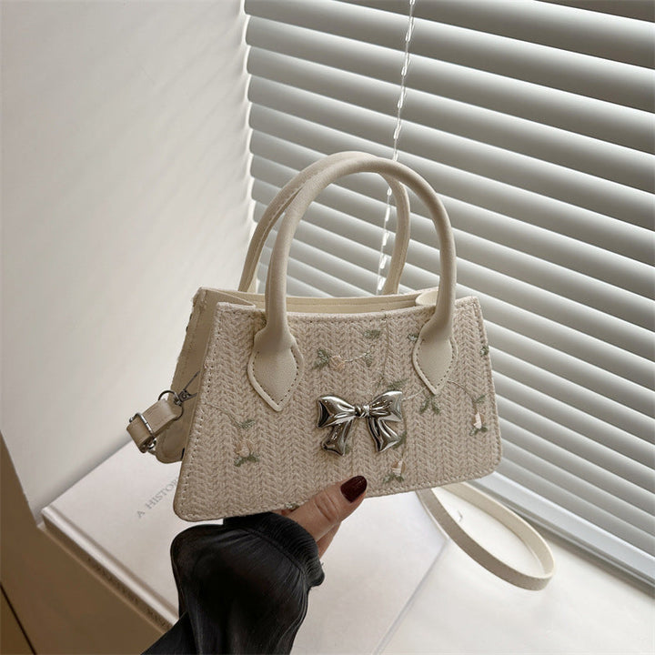 Ladies mini bag with floral woven design and stylish bow detail