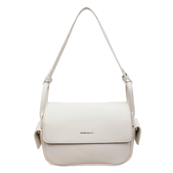 Women’s shoulder bag made of soft, textured leather with adjustable shoulder strap