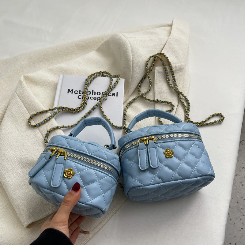 Women's mini bag in elegant quilted design with golden accents