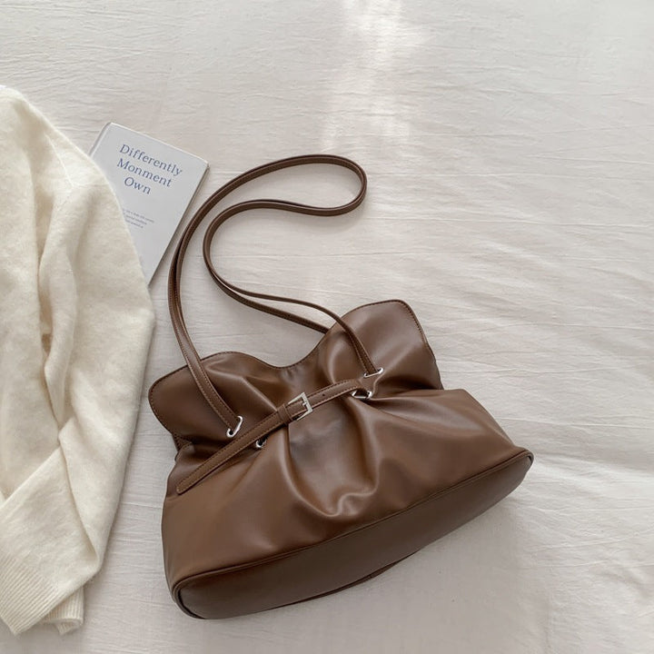 Women's shoulder bag made of high-quality synthetic leather with adjustable drawstring