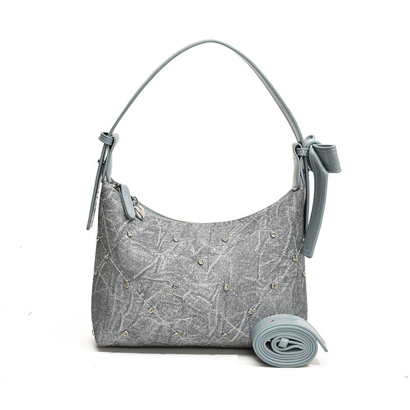 Ladies fashionable shoulder bag with sparkling appliqués