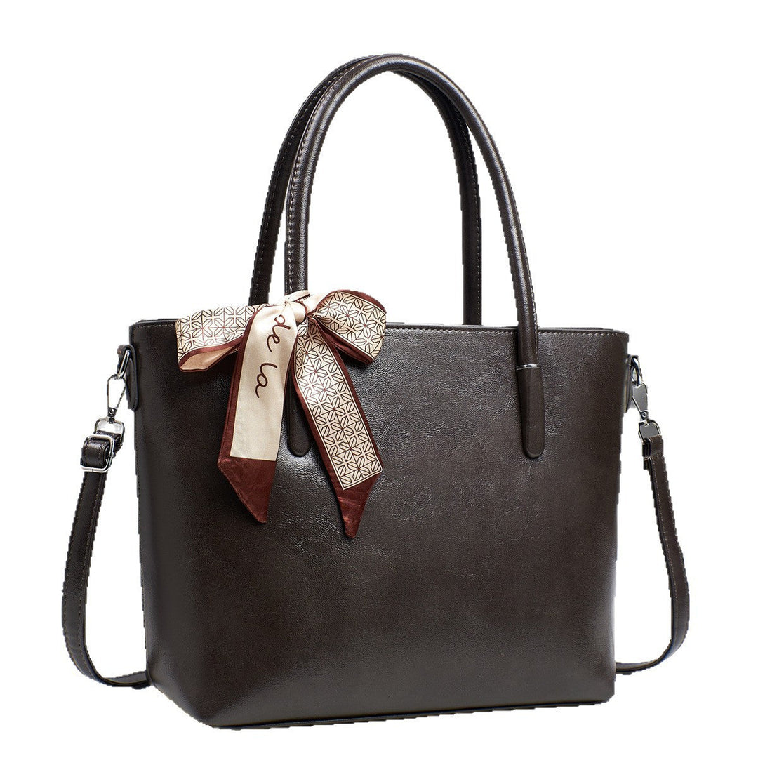 Women's elegant shoulder bag with playful bow accent
