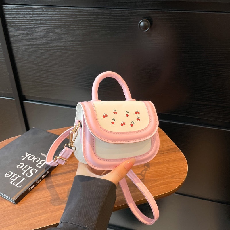 Women's mini handbag with cheerful cherry design and charming pendants
