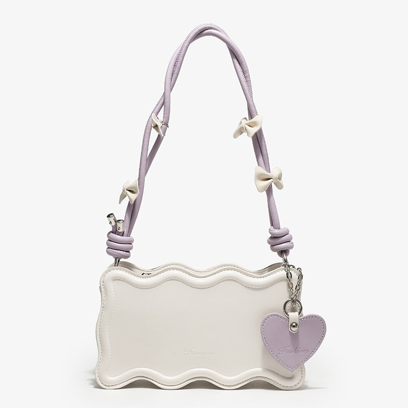 Ladies mini handbag with creative wave pattern and playful pendant