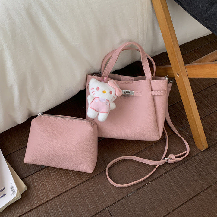 Ladies mini handbag with detachable cosmetic pouch