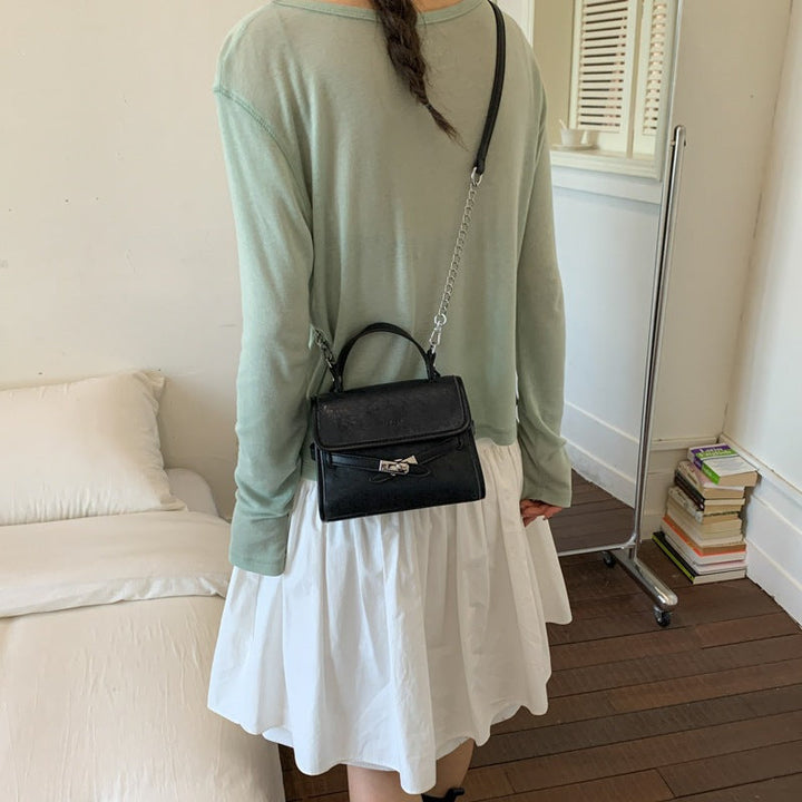 Ladies fashionable mini handbag with decorative magnetic closure