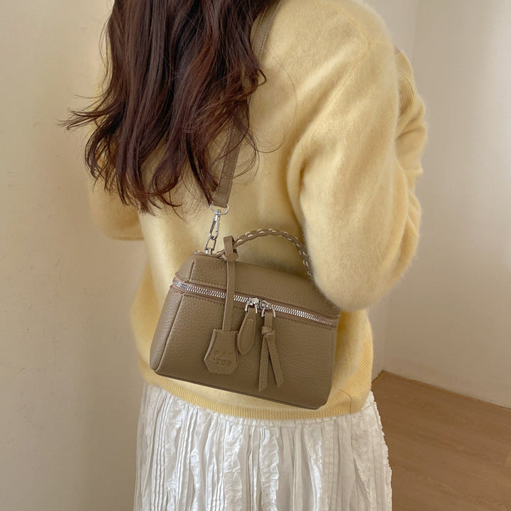 Women's mini handbag with fine decorative seams and detachable shoulder strap