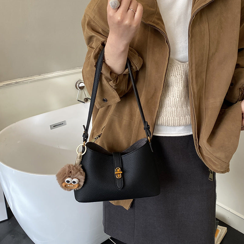 Women's multifunctional shoulder bag with playful charm