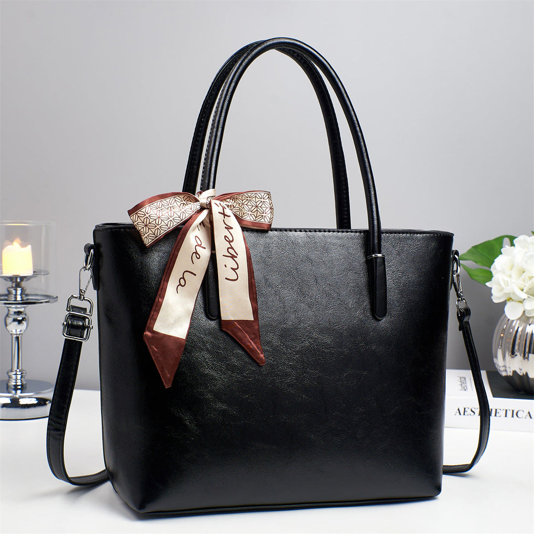 Women's elegant shoulder bag with playful bow accent