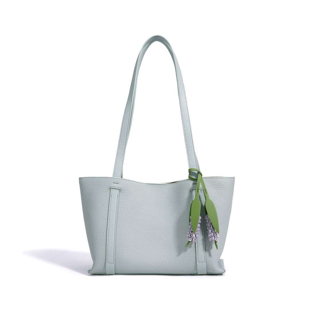 Ladies stylish tote bag with floral pendant