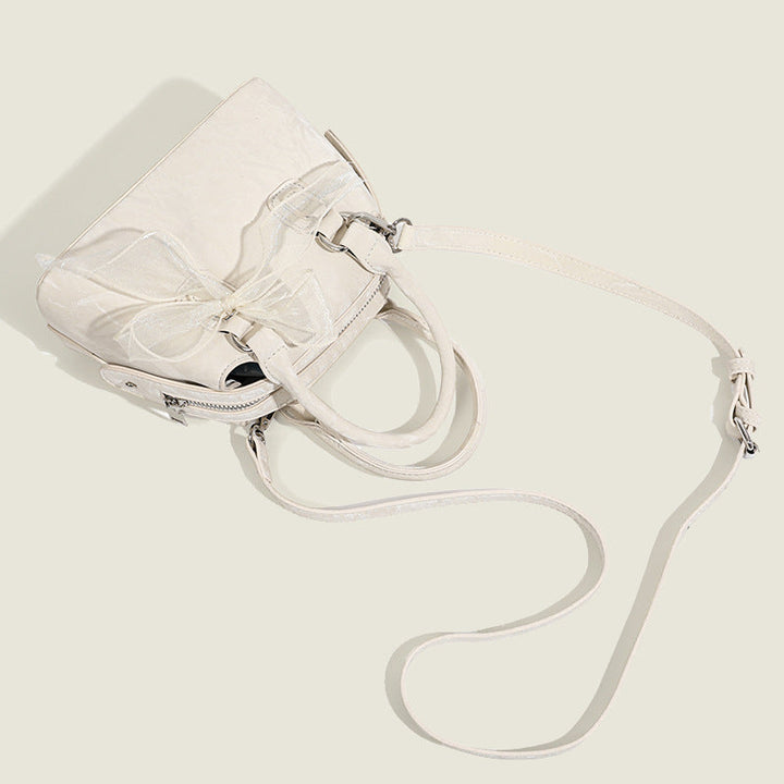Women’s mini handbag with playful bow accent