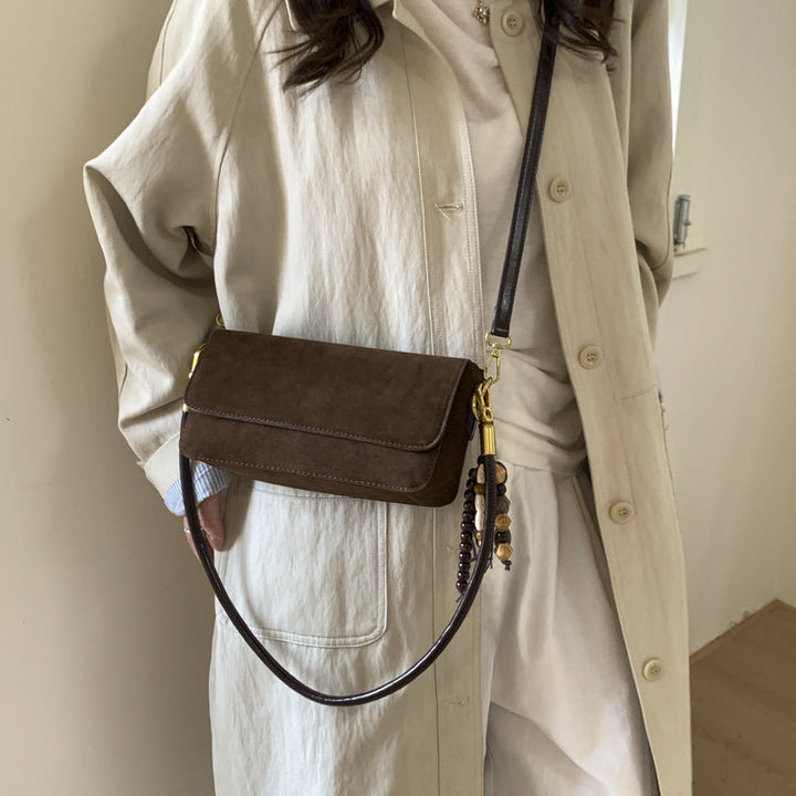 Women's shoulder bag made of fine suede leather with practical shoulder strap