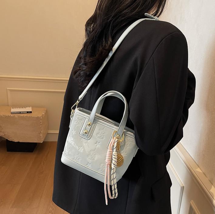 Ladies mini bag in playful design with decorative charm
