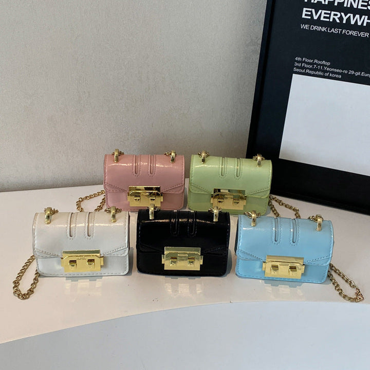Women's elegant mini handbag with gold fastening mechanism