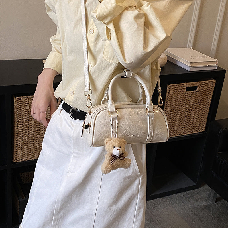 Women's mini handbag with playful teddy pendant