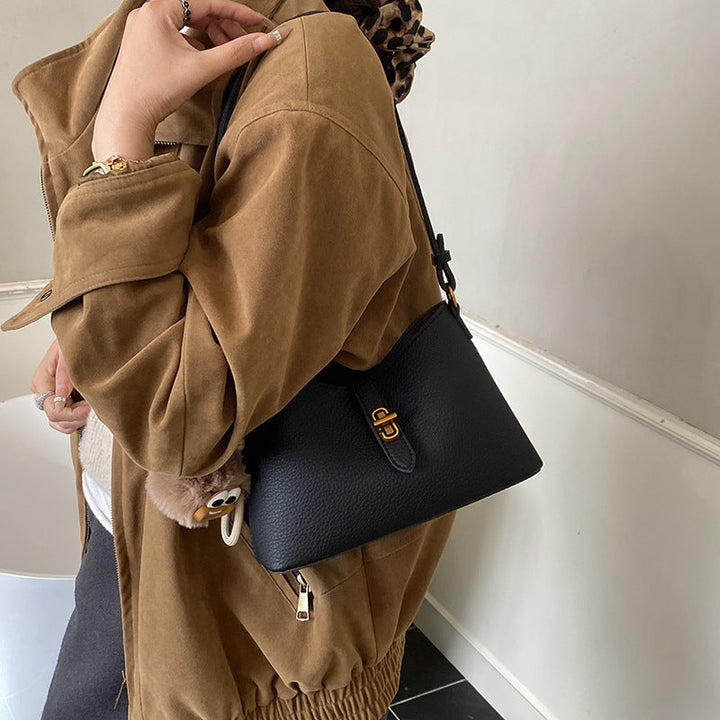 Women's multifunctional shoulder bag with playful charm