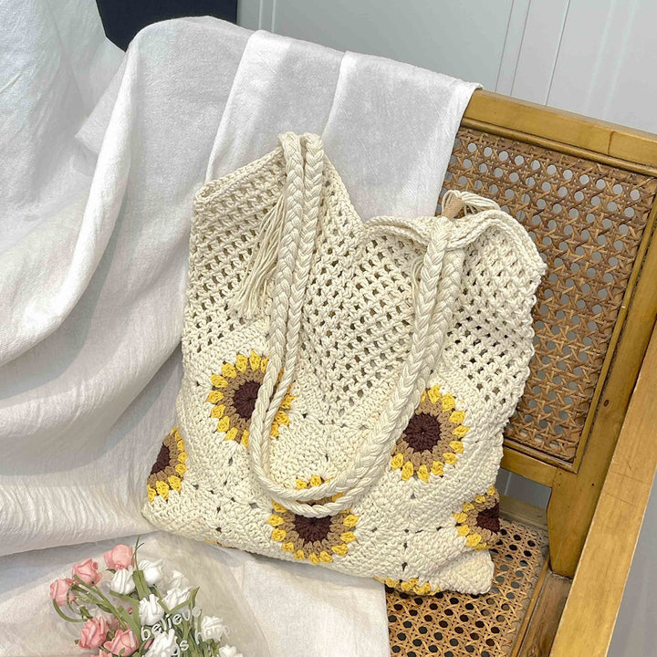 Ladies crocheted shoulder bag with playful sunflower appliqués