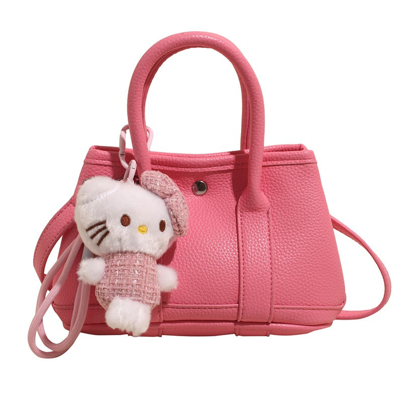 Women’s mini handbag with playful plush pendant