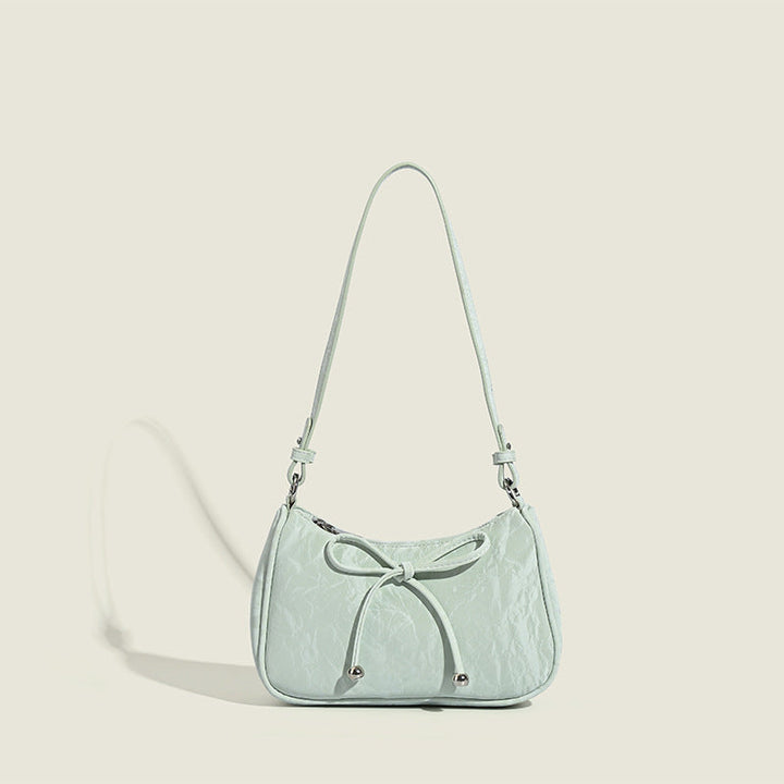 Ladies elegant mini handbag with playful drawstring