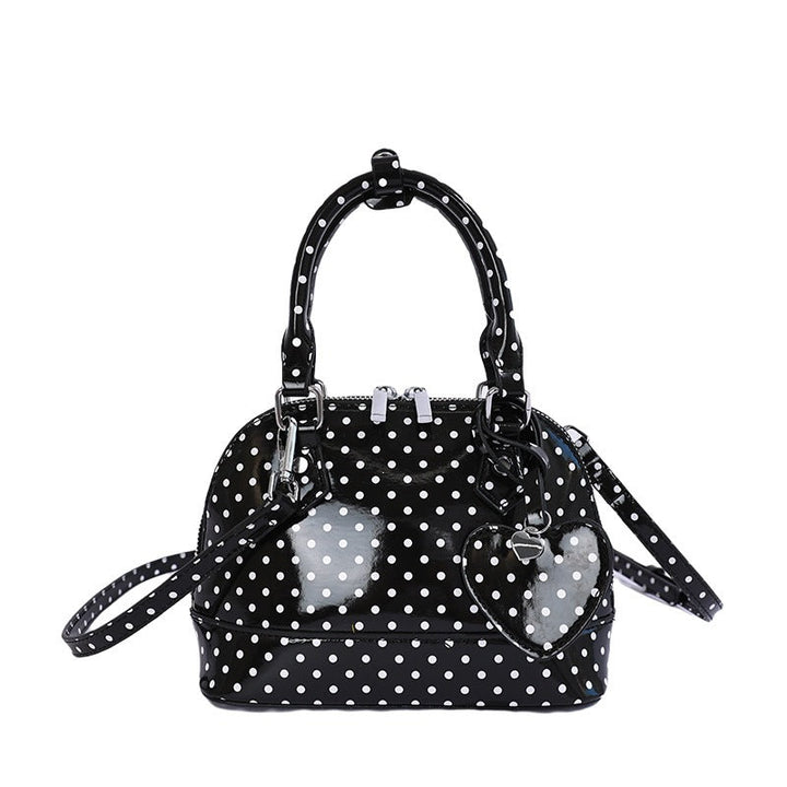 Women’s mini handbag with playful polka dot pattern and detachable shoulder strap