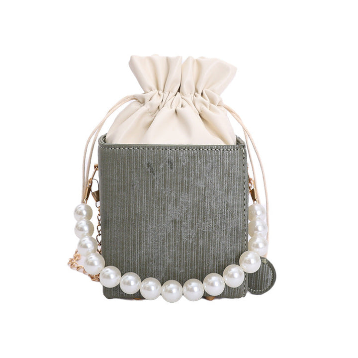 Ladies stylish mini handbag with drawstring and pearl accent
