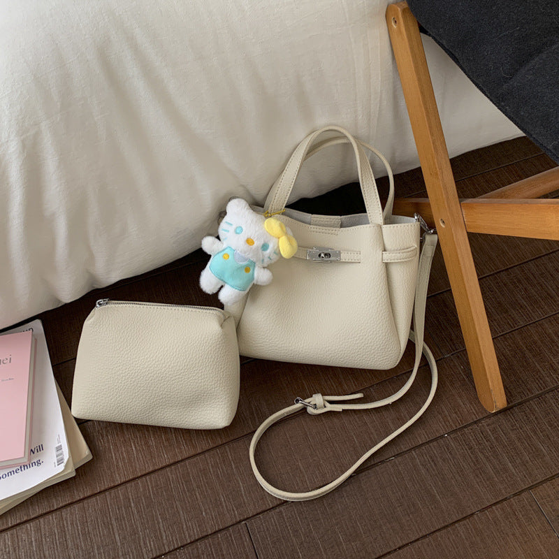 Ladies mini handbag with detachable cosmetic pouch