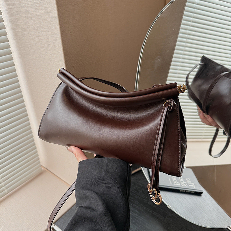 Women's elegant shoulder bag with modern, curved design