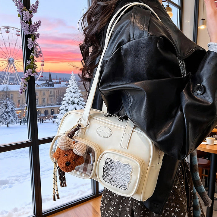 Women's shoulder bag with unique drawstring and charming pendant