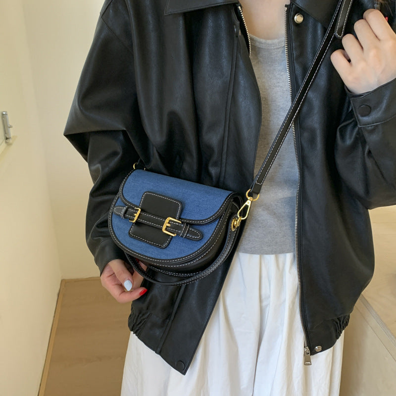 Women’s shoulder bag made of durable denim with leather accents