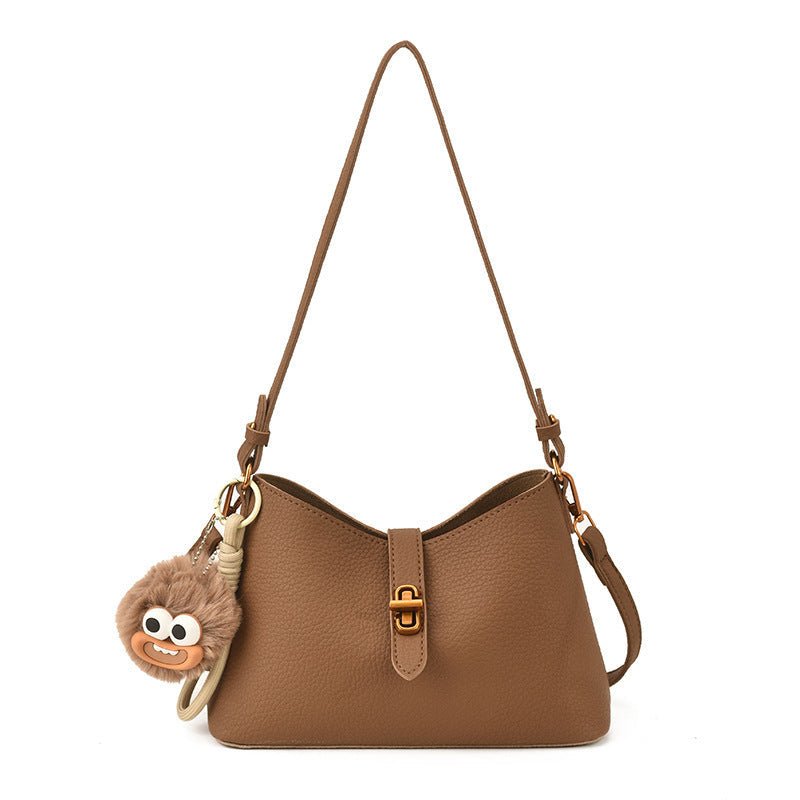 Women's multifunctional shoulder bag with playful charm