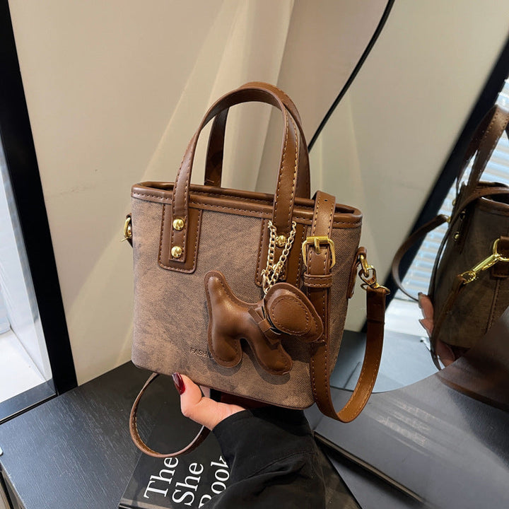 Women's mini bag made of high-quality material with removable funny charm