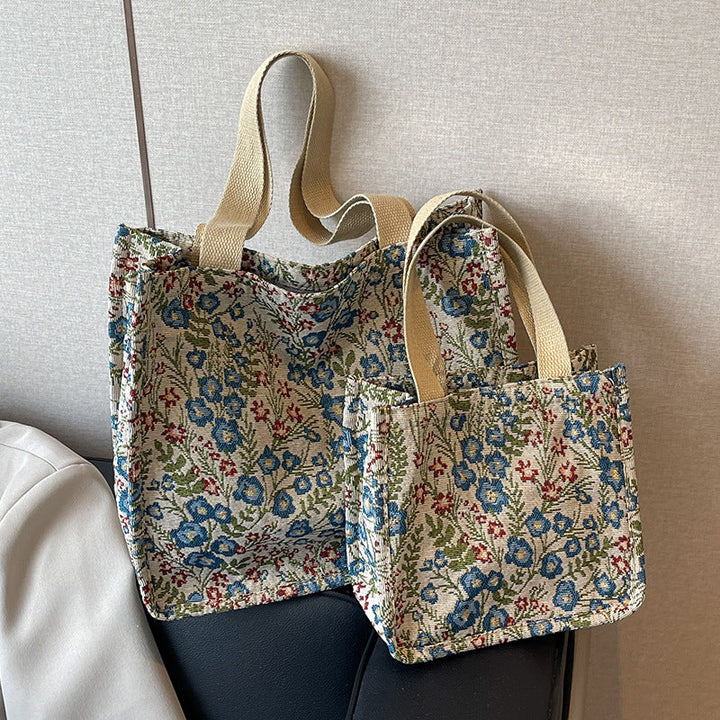 Women's tote bag with floral embroidery design and sturdy handles