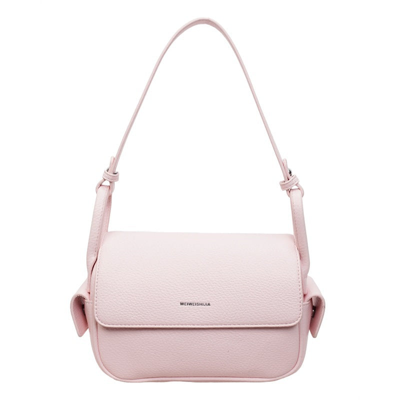 Women’s shoulder bag made of soft, textured leather with adjustable shoulder strap