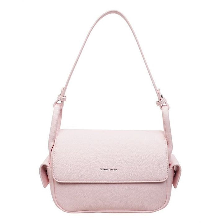 Women’s shoulder bag made of soft, textured leather with adjustable shoulder strap