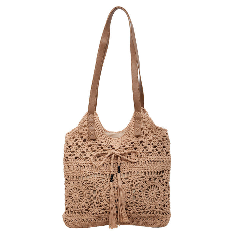 Ladies' crochet shoulder bag with playful fringes and decorative details