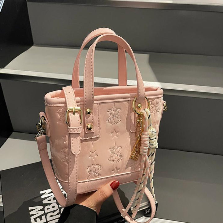 Ladies mini bag in playful design with decorative charm