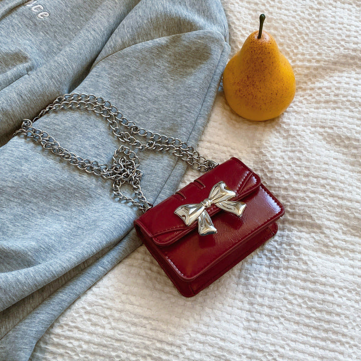 Ladies Mini Handbag with Shimmering Bow Closure