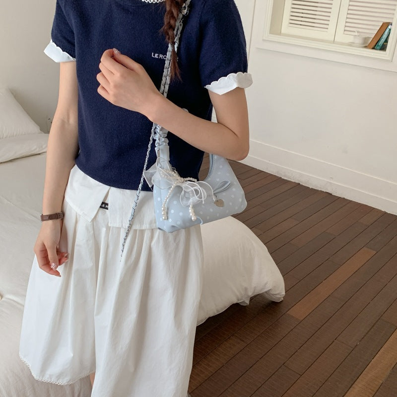 Women's mini handbag with decorative accents