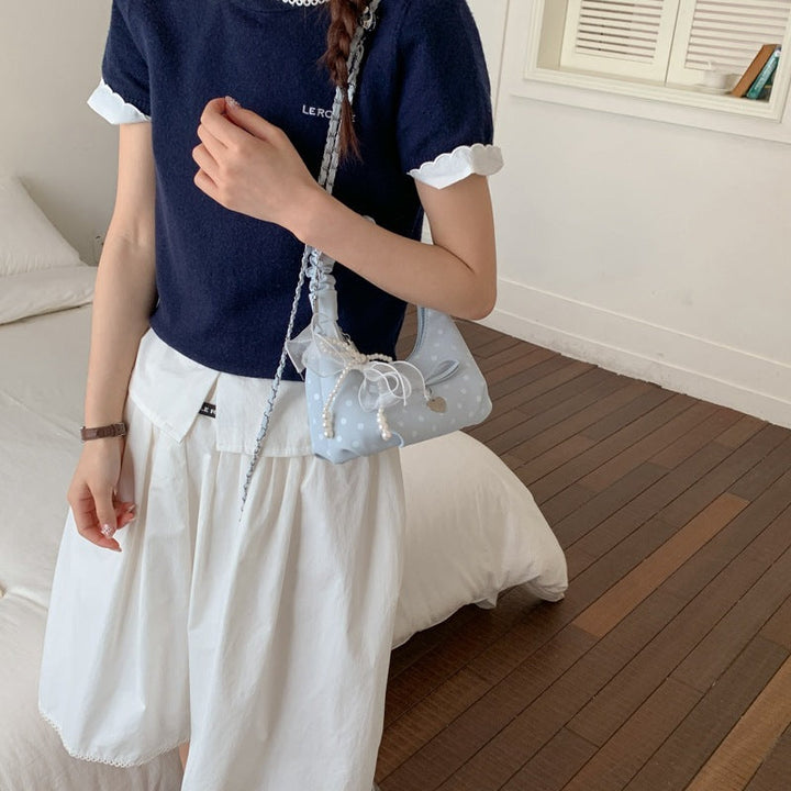 Women's mini handbag with decorative accents