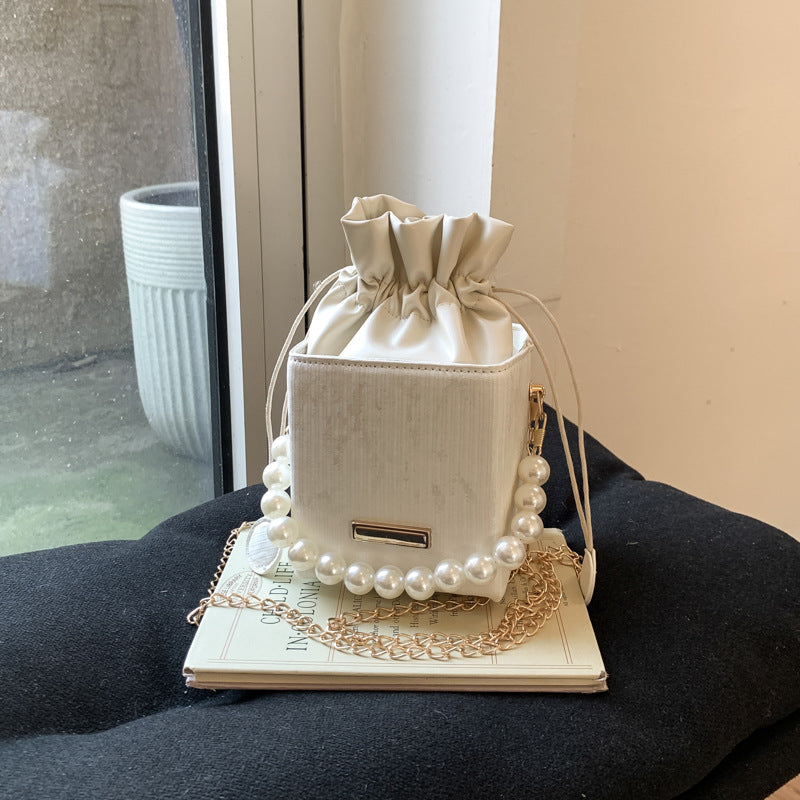Ladies stylish mini handbag with drawstring and pearl accent