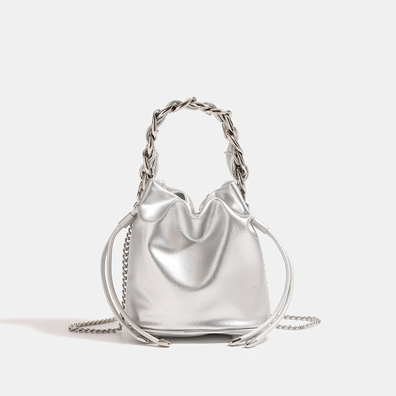 Women's mini backpack bag with elegant chain handle and fine texture