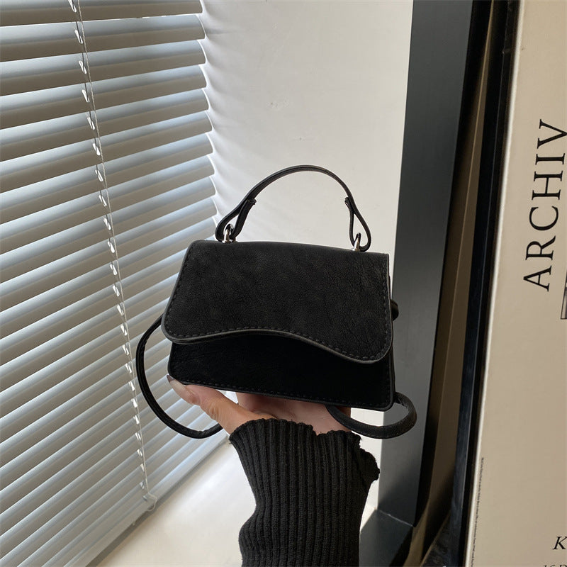Women's mini handbag with removable carry handle