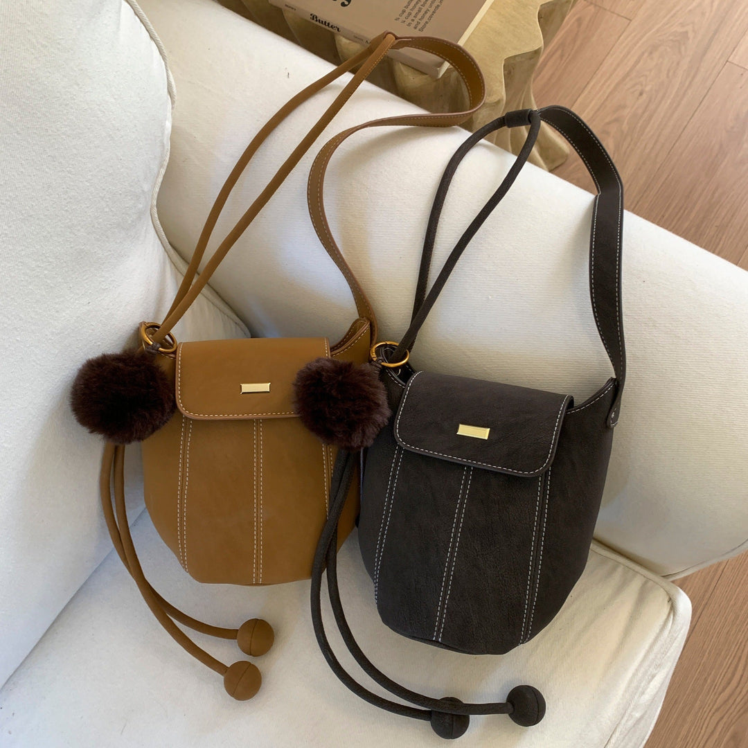 Ladies fashionable crossbody bag with fluffy pendant