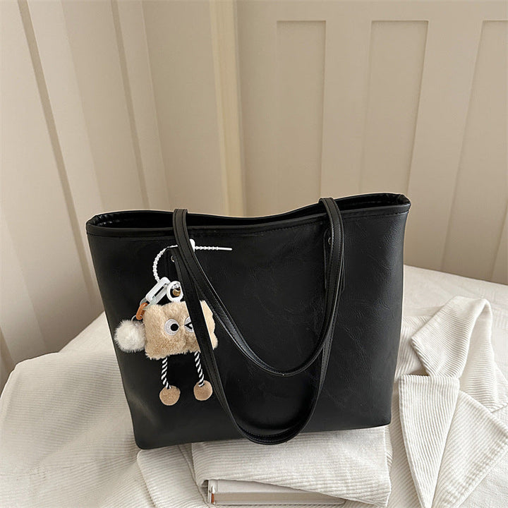 Women's classic tote bag with charming plush toy pendant