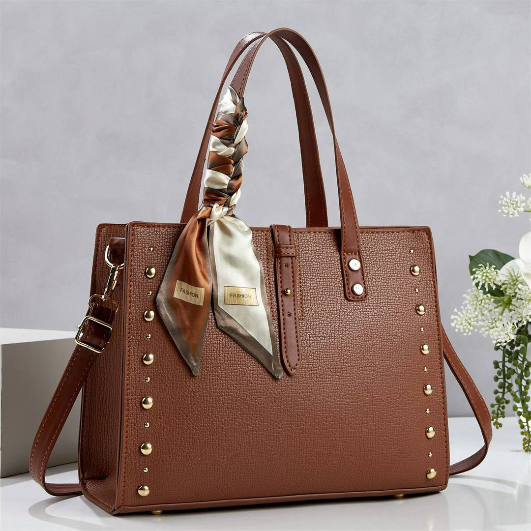 Ladies elegant tote bag with golden studs and fashionable scarf