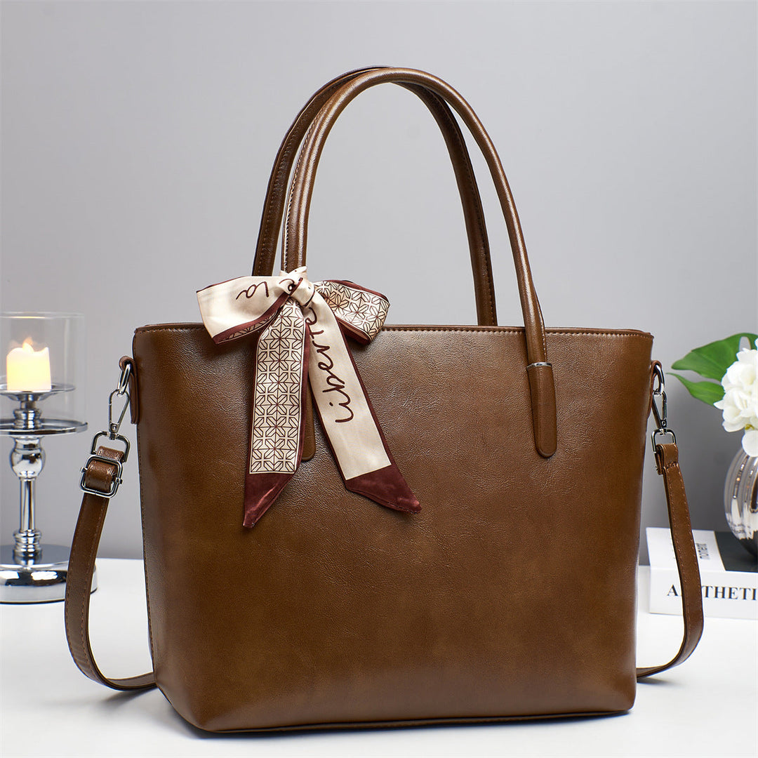 Women's elegant shoulder bag with playful bow accent