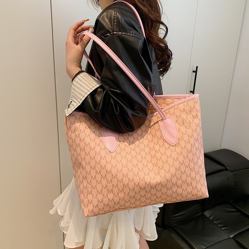 Women's tote bag made of high-quality, durable material with elegant monogram
