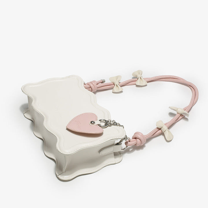 Women's mini handbag with creative wave pattern and playful pendant