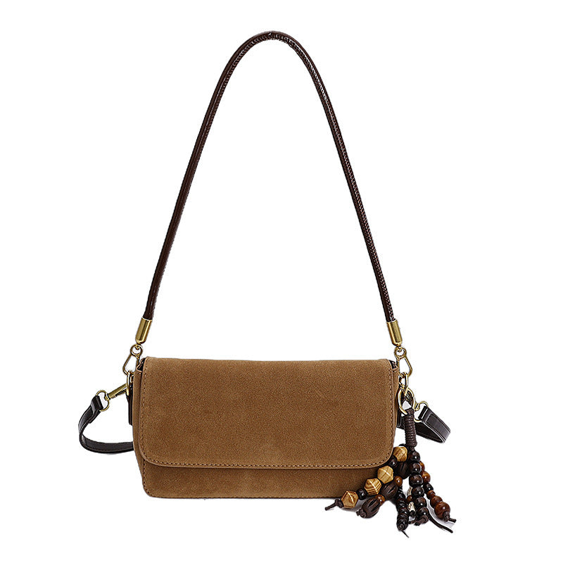 Women's shoulder bag made of fine suede leather with practical shoulder strap